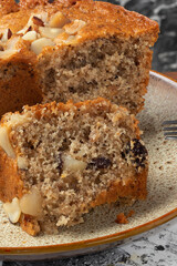 A little piece of nuts cake on a plate.