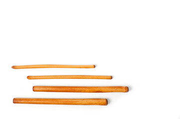 Four bamboo sticks to massage the face and other parts of the body.