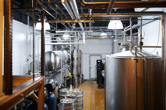Equipment for the production of craft beer, containers for fermentation in the climatic chamber, pressure gauge with tubes and stainless steel tanks.