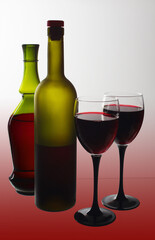 Two glasses with red wine, bottles of wine on gradient red background.
