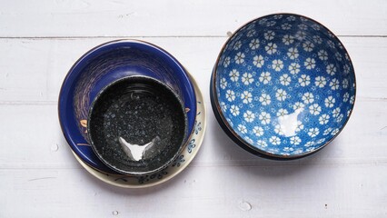 Above of crockery set with porcelain ceramic round dish isolated on white table background.