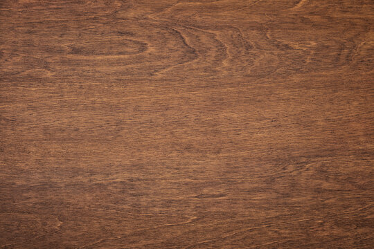 dark wood grain, brown board with a natural pattern. wooden background