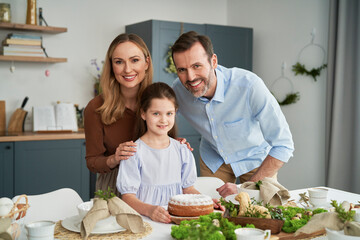 Portrait of caucasian family over easter dinner table