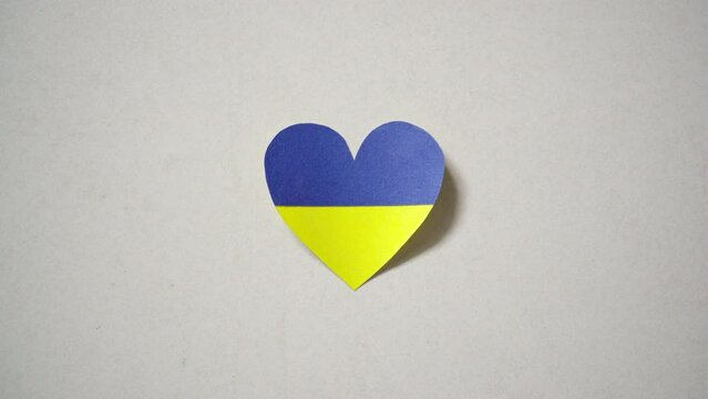 Ukraine flag color heart made of paper