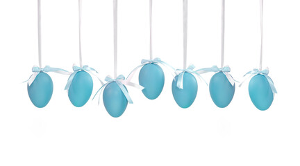 Seven blue Easter eggs hanging on white ribbons with a small bow isolated on a white background. Monochrome Easter eggs.