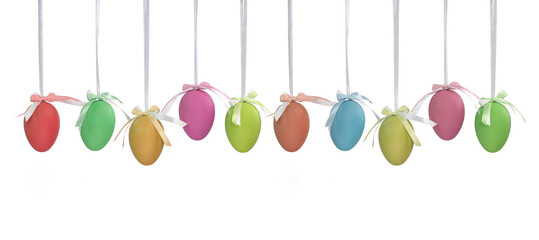 Ten coloured Easter eggs hanging on white ribbons isolated on a white background. Single coloured plain Easter eggs. Easter background
