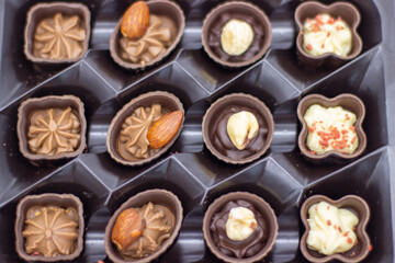 Few chocolates in brown box