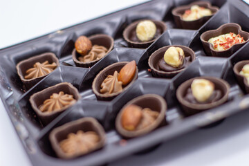 Few chocolates in brown box
