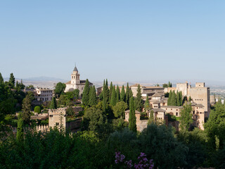 Fototapeta na wymiar Amazing sunny View of the Alcazaba in Alhambra, Granada. Moorish Architecture. Unesco World Heritage Spain. Travel in time and discover history. Amazing destinations for holidays. 
