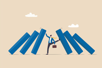 Crisis management, leadership to manage disaster situation, challenge to overcome difficulty in economic crisis concept, confident businessman use his hand to stop domino fall and foot to stop others.