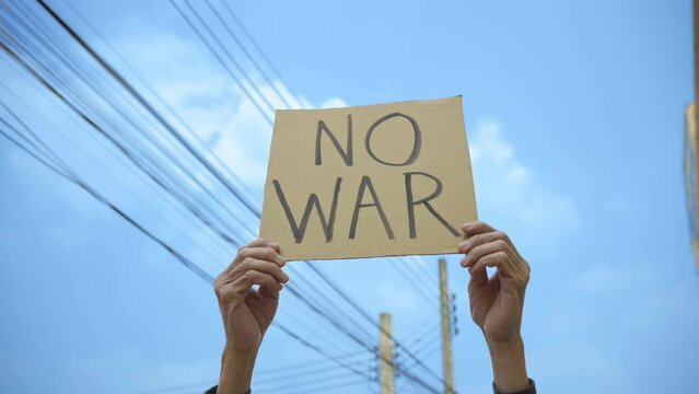 Demonstrator holding no war sign