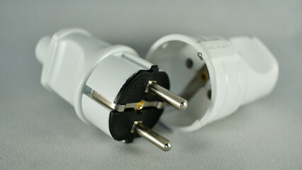 male and female power plug. Wireless plug end. Grounded plug.
