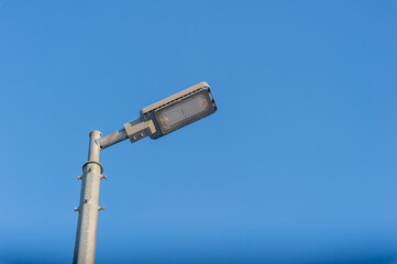 Modern LED lantern against the sky. Green energy in cities.