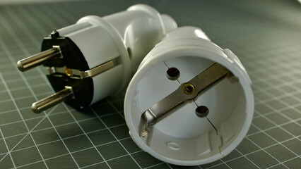 male and female power plug. Wireless plug end. Grounded plug.