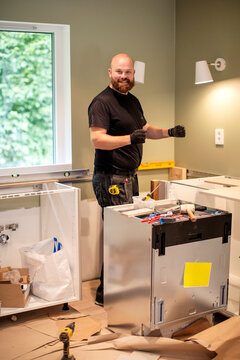 Man Renovating Kitchen