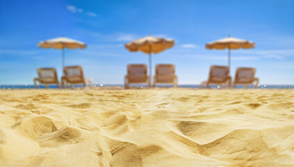 sun loungers on the beach. Soft sand with a view of the sea.
