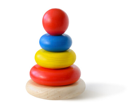 Toy pyramid build from colored wooden rings isolated on white background.