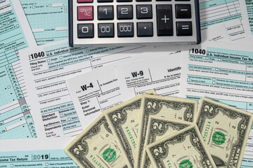 us dollar with calculator on tax form, tax time