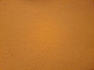 Yellow ochre painted stucco wall. Background texture.