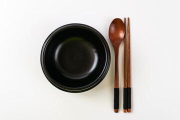 Clay pot and tableware on a white background