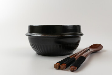 Clay pot and tableware on a white background