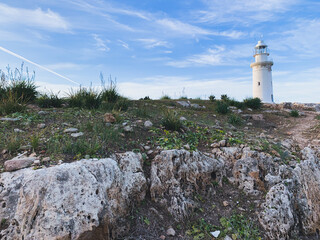 White lighthouse in the idyllic landscape