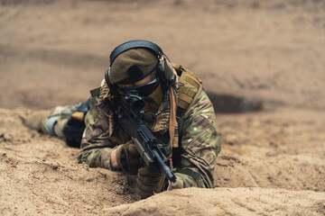 Firing in the hole looking for escaped prisoners at battlefield . High quality photo