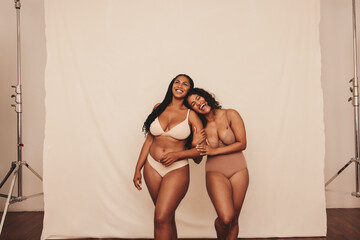Two women loving being in their natural bodies