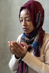 Young muslim woman praying. Islam, muslim religion concept