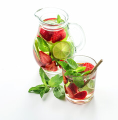 Detox fruits infuse water with ice, strawberry, mint and lime. Refreshing summer cocktail, selective focus.