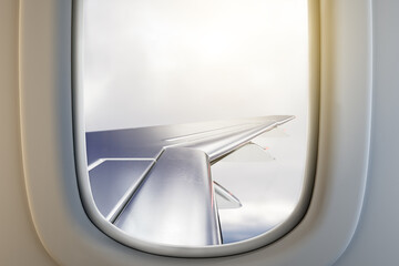 Airplane illuminator wing view on gloomy sky background with mock up place. Trip and flight concept. 3D Rendering.