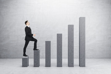 Businessman walking on abstract business chart bars on concrete wall background. Financial, career growth and success concept.