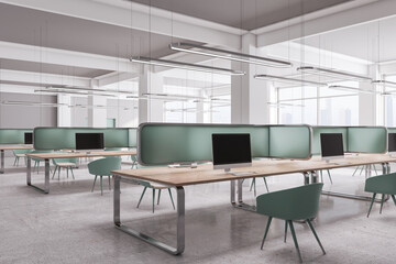Contemporary coworking office interior with mock up place on computer screens, window and city view, furniture and equipment. Design and workplace concept. 3D Rendering.