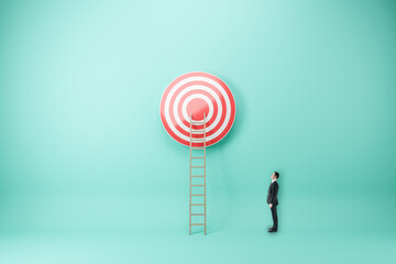 Businessman looking at abstract ladder leading to bulls eye target on blue wall background....