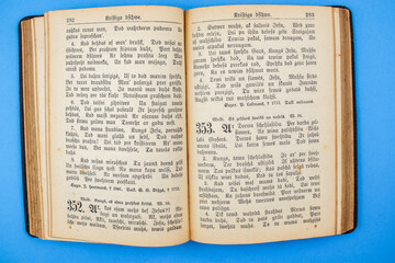 Fototapeta premium Old, Vintage Bible book on blue background