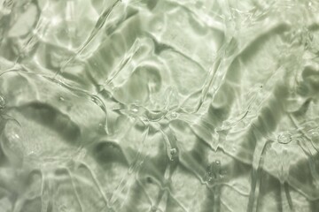 Liquid gel cosmetic smudge green background