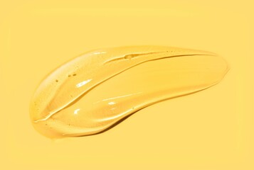 Liquid gel cosmetic smudge yellow smudge background