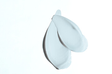 Liquid cream cosmetic smudge texture on a white background