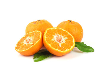 Group of juicy orange fruits with leaves on white background