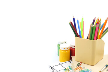 Stationery background - Color pencils ,clip binder and poster color on white