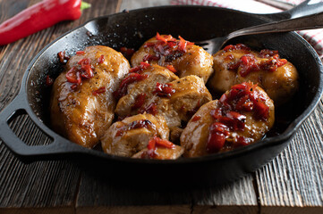 Pan fried chicken breast with spicy chili pepper, honey, garlic sauce