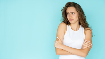 Displeased situation. Offended woman. Unhappy feelings. Upset pretty lady in white dress crossing...