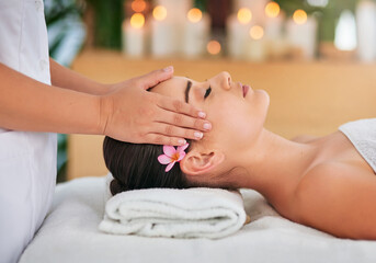 Obraz na płótnie Canvas Let your stress simply melt away. Cropped shot of an attractive young woman enjoying a head massage at a spa.