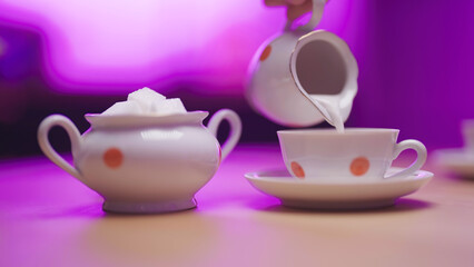 Adding milk to tea cup retro traditional set of porcelain