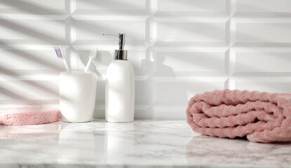 Marble table in the bathroom with free space, shadows of light on the tiled wall 