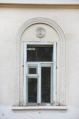 Fototapeta na wymiar Old window in an old stone building, close-up.