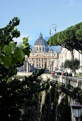View of St. Peter's Cathedral in the Vatican in the middle of the Italian city of Rome  - 491602225