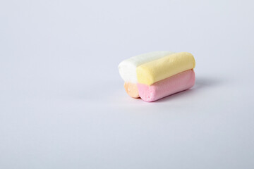 One piece of sweet tasty marshmallow on white background. Close-up