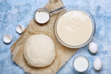 Different dough with ingredients on color background