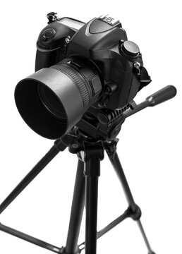 Photo camera on tripod isolated at white background